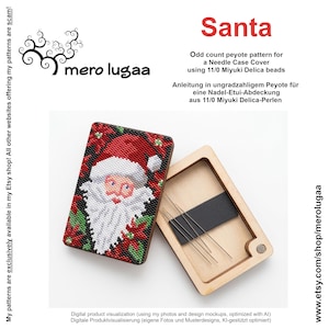 May include: A rectangular wooden needle case featuring a beaded cover with a Santa Claus design in red, white, and green. The case is open, revealing a light wood interior with a black magnetic strip holding several thin metal sewing needles.