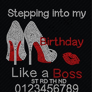 May include: Red and white rhinestone design featuring a pair of high heels and a red lip. The text "Stepping into my Birthday Like a Boss" is written in white rhinestones. The numbers 0123456789 are written in red rhinestones.