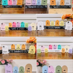 Pu&ograve; includere: Un set di dieci decorazioni di fantasmi di Halloween con nomi e frasi diverse. I fantasmi sono dipinti in vari colori pastello e hanno occhi e bocche neri. I fantasmi sono disposti in fila su una base di legno nero con le parole "Sweet & Spooky", "Thompson's Boo Crew", "Spooky Season", "The Quigley Boo Crew", "Fisher's Boo Crew" e "G-Mais Boo Crew" scritte su di essi.