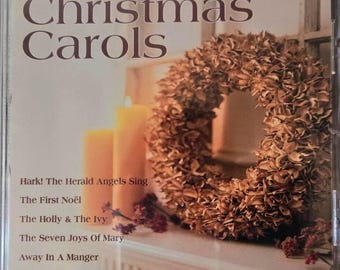 Villancicos de Annie Russell Marble 2002 Nunca abierto, todavía sellado en la envoltura retráctil de fábrica. Importado de Canadá y también muy raro.