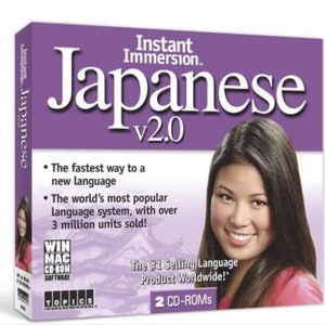 May include: Purple box with a white and black image of a woman smiling. The box is for a Japanese language learning software called Instant Immersion Japanese v2.0. The box says "The fastest way to a new language" and "The world's most popular language system, with over 3 million units sold!" It also says "The #1 Selling Language Product Worldwide!" and "2 CD-ROMs".