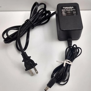 Toshiba Genuine Brand Name ac adapter model AD:121ADT 12 volt 1 amp center pin is positive Output Voltage 12 V 1 amp & Toshiba Brand New