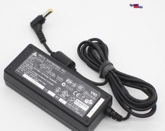 Genuine 65W Delta SADP-65KB B AC Adapter Power Supply Output 19V 3.42A New in Box. Center pin is positive. Comes with both cables.