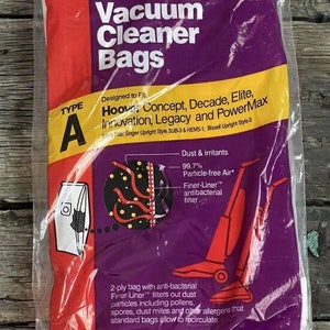 May include: A package of two Rug Doctor MicroFiltration vacuum cleaner bags, type A, designed to fit Hoover Concept, Decade, Elite, Innovation, Legacy and PowerMax vacuums. The package is purple and yellow with a red vacuum cleaner on the front. The text on the package says "Dust & irritants 99.7% Particle-free Air* Finer-Liner™ antibacterial filter..."