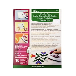 May include: A pack of 10 sheets of Wonder Fuse fusible web for crafts. The pack is green and white with an image of an iron and a quilt block. The text on the pack reads "Wonder Fuse Papier Thermofusible Prodige Fusible Prodigioso Wundervlies".