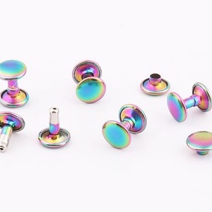 May include: Assortment of rainbow iridescent metal rivets, some with a post and some with a flat back.
