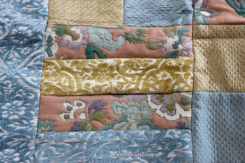 Quilted table mat in yellow and blue floral velvet for children.