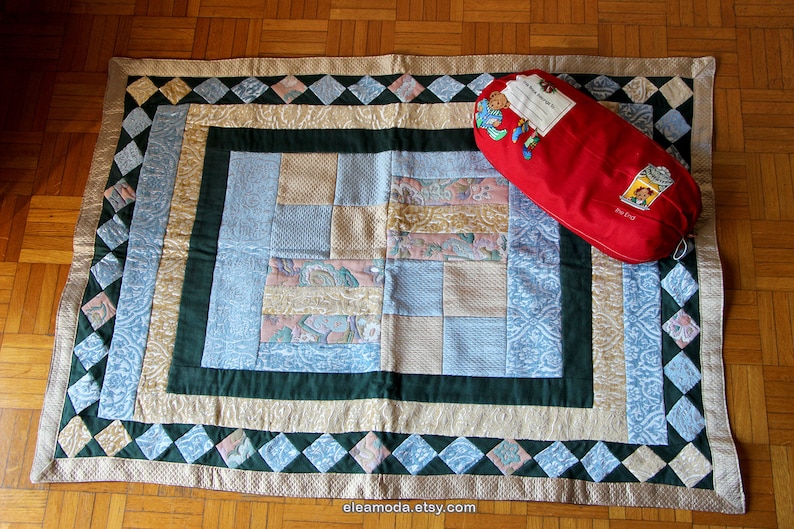 Quilted table mat in yellow and blue floral velvet for children.