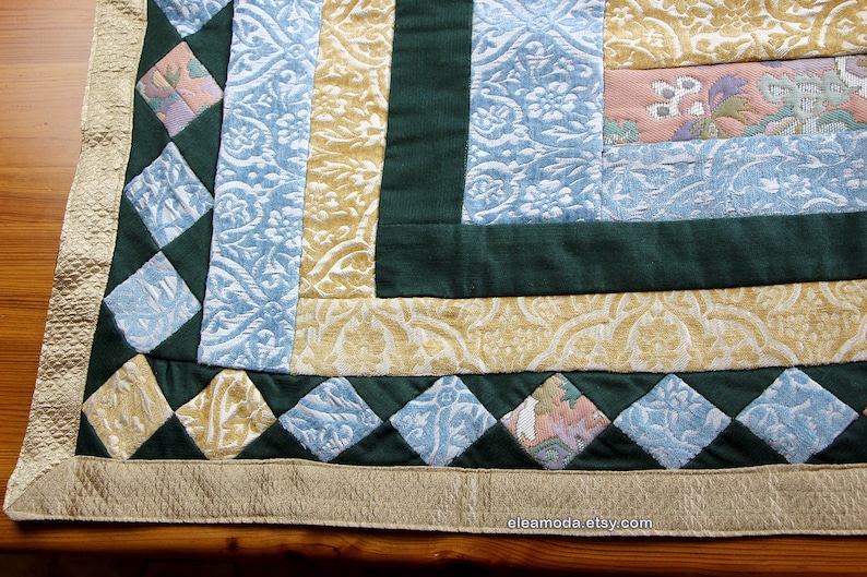 Quilted table mat in yellow and blue floral velvet for children.
