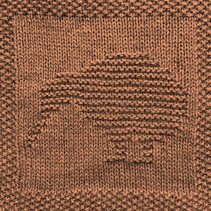 May include: A brown knitted dishcloth with a woven pattern.