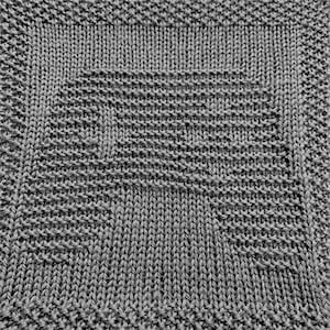 May include: Close-up of a grey knitted fabric with a textured pattern.