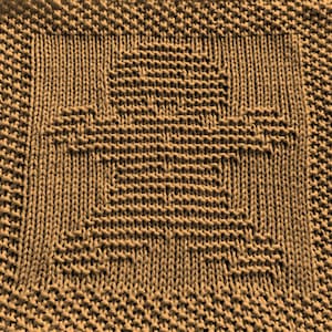 May include: A brown knitted dishcloth with a square pattern in the center.