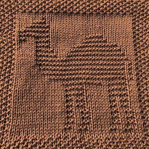 May include: A close-up of a brown knitted fabric with a geometric pattern. The fabric is made of a soft, textured yarn and has a subtle sheen.