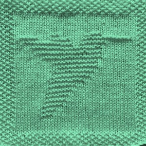 May include: A green knitted dishcloth with a woven pattern.