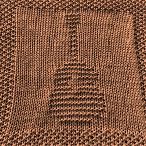 May include: A brown knitted dishcloth with a textured pattern.