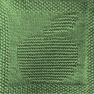 May include: A close-up of a green knitted fabric with a textured pattern. The fabric is made of a soft, comfortable material and has a subtle sheen.