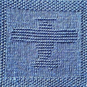 Könnte beinhalten: Nahaufnahme eines blauen gestrickten Stoffes mit einem quadratischen Muster.