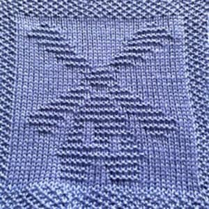 May include: A blue knitted dishcloth with a geometric pattern.