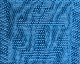 May include: A blue knitted dishcloth with a geometric pattern.