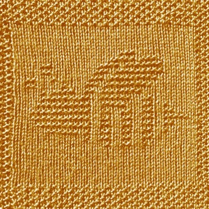Op de afbeelding: Een close-up van een gebreide stof met een textuurpatroon. De stof is effen goudgeel.