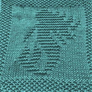 May include: A teal blue knitted dishcloth with a textured pattern.