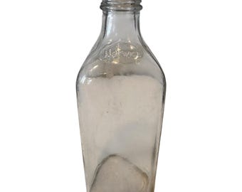 Frasco de boticario antiguo de vidrio transparente de Norwich con relieve triangular.