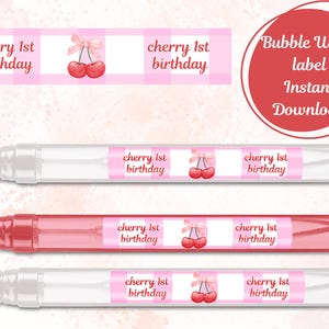 May include: Bubble wand labels with a pink gingham pattern and cherry illustrations. The labels read "cherry 1st birthday." A red circle with the text "Bubble Wand label Instant Download" is also present.