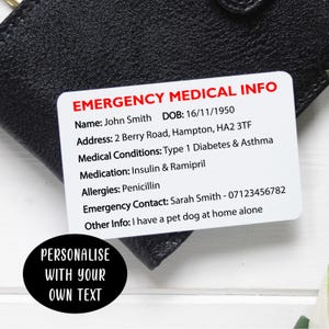 May include: A white rectangular emergency medical information card with rounded corners, featuring red text at the top and black printed details including name, address, medical conditions, medication, allergies, contact, and a black oval label.