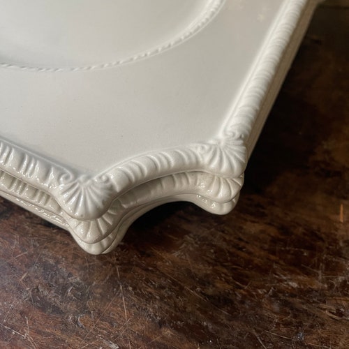 Set shops of Four (4) Italian White Plates in the Style of Carole Stupell