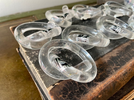 Set of eight (8) vintage lucite napkin rings