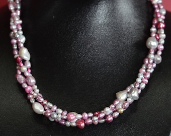 Beautiful necklace of freshwater pearls, pastel color scheme, gradients of pinks and grays.