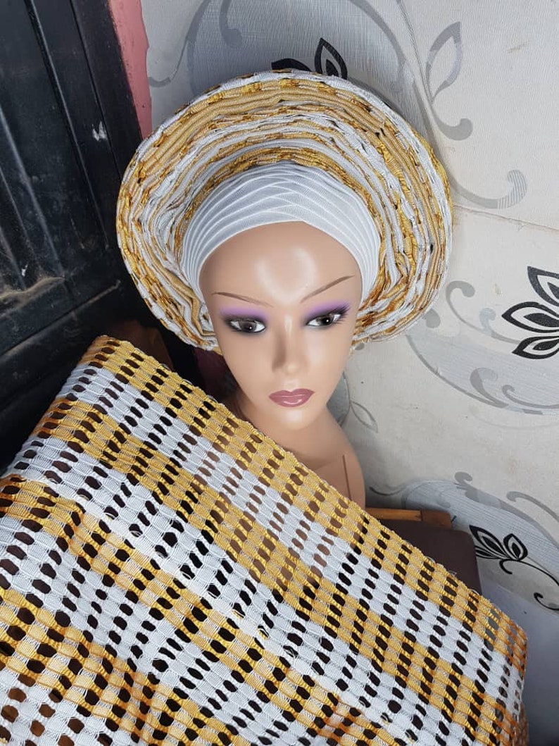 white lace and gold gele