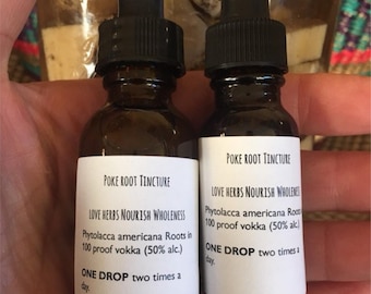 May include: Two small brown glass bottles with black dropper tops. Each bottle has a white label with black text that reads "POKE ROOT TINCTURE" and "LOVE HERBS NOURISH WHOLENESS". The text on the label also includes the ingredients and dosage instructions.