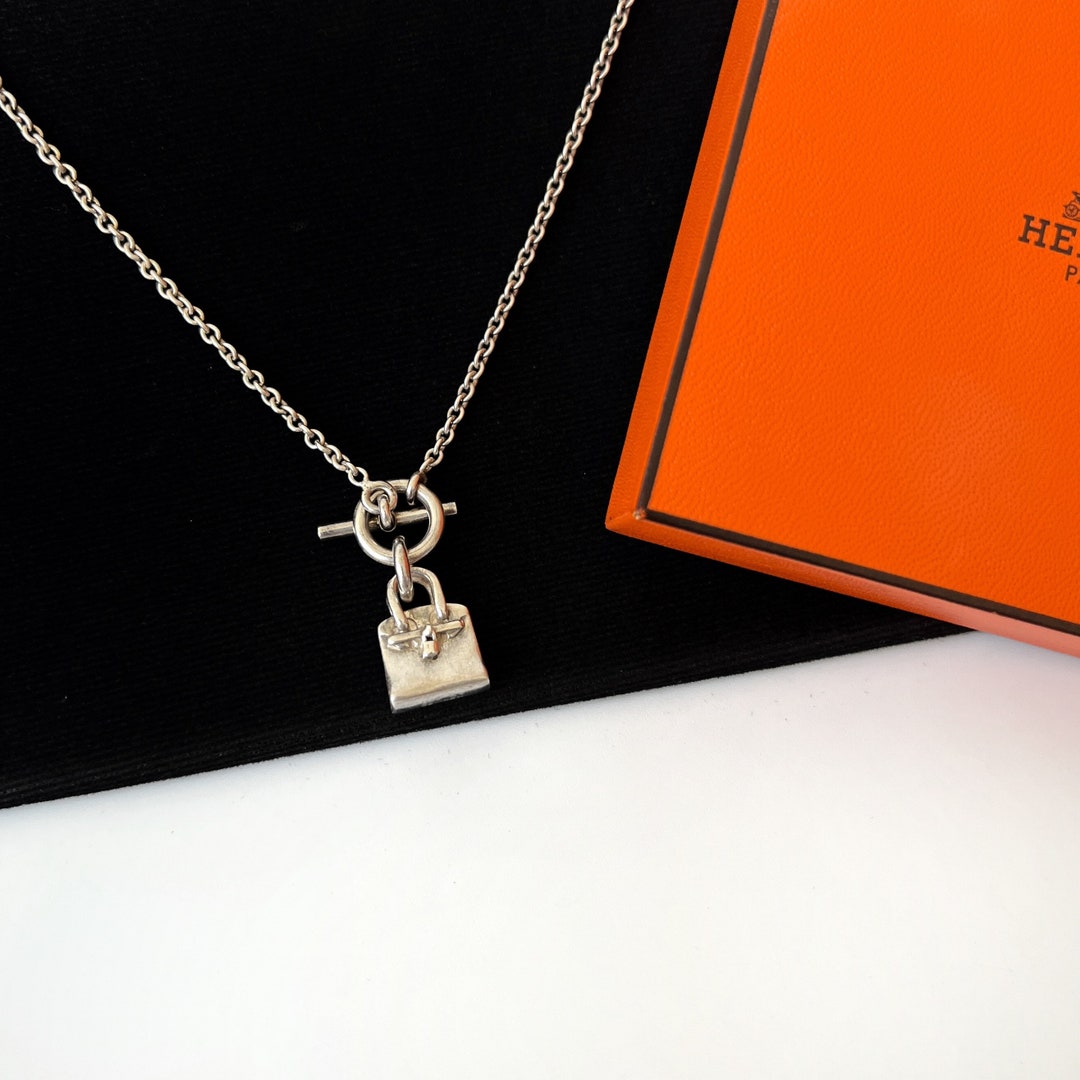 NEW HERMES NECKLACE AMULETTES H 40CM SS SILVER METAL