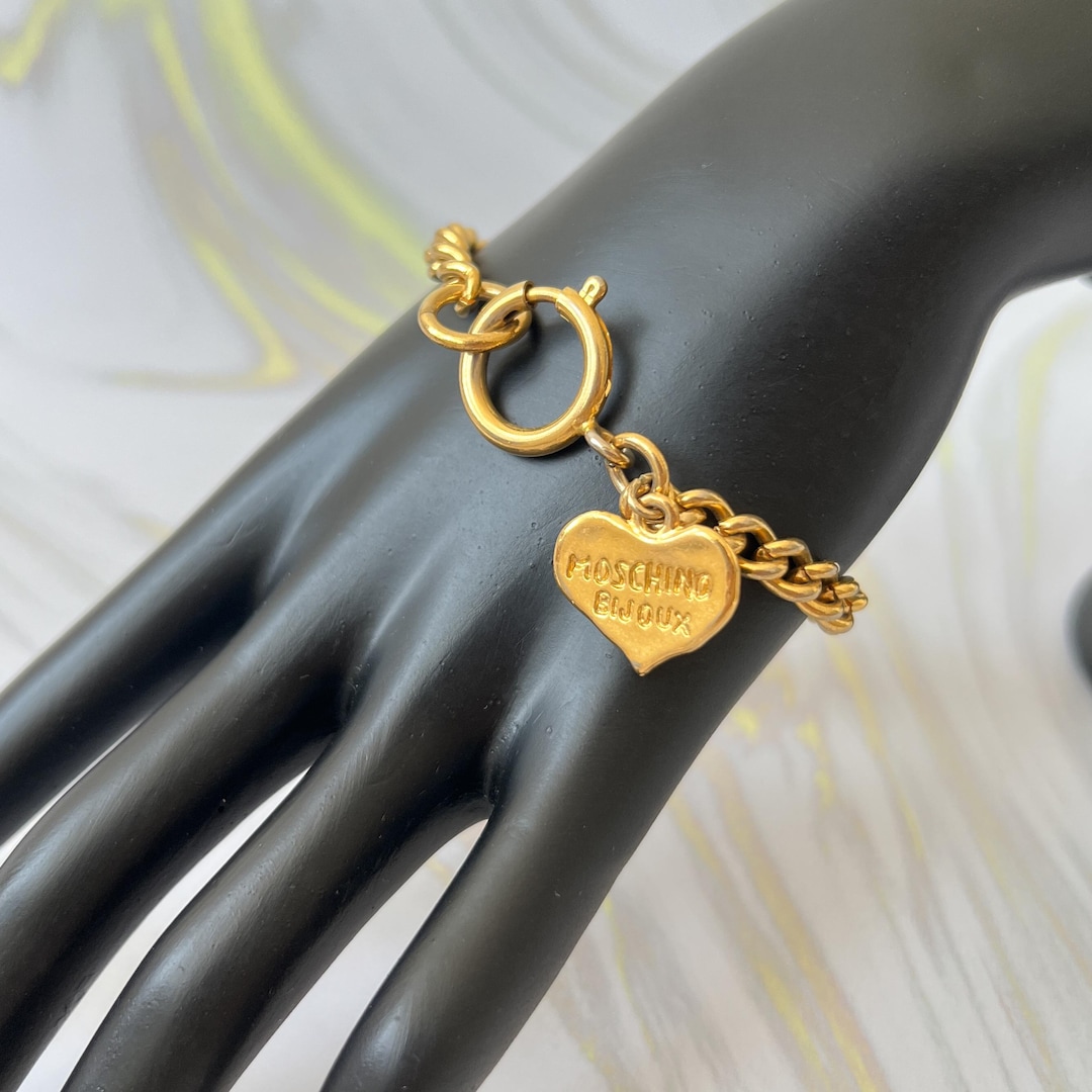 モスキーノ MOSCHINO アクセサリー チャーム ハート 楽器 ゴールド il_1080xN.6767833301_pxqa.jpg