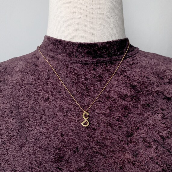 Christian dior logo best sale necklace