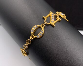 MOSCHINO ヴィンテージ コイン ロゴ リンク ブレスレット MOSCHINO Vintage Crystal Logo Link Bracelet - Etsy