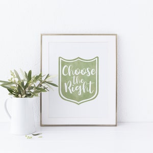 May include: A framed print with a green watercolor shield design and the text "Choose the Right" in white lettering.