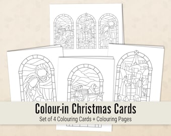 May include: Set of four black and white coloring cards featuring stained glass style illustrations of Christmas scenes. The cards include a nativity scene, a shepherd scene, and two other scenes.