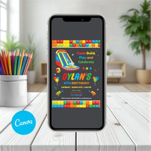 May include: A smartphone displays a birthday party invitation. The invitation features a colorful inflatable water slide graphic with the text "Come Build, Play and Celebrate" and "Dylan's 6th Birthday!" The design includes balloons and building block borders.