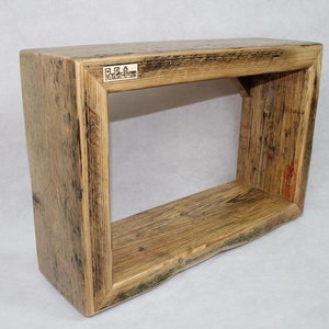 Wall shelf made from an old used scaffolding plank