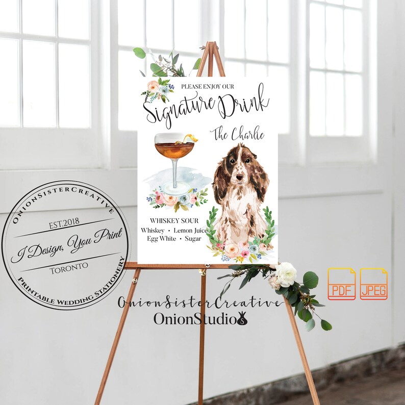 May include: A printable wedding sign with a watercolor illustration of a cocktail, a dog, and floral accents. The sign says "Please enjoy our Signature Drink The Charlie" and lists the ingredients for a Whiskey Sour.