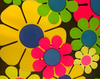 May include: A collection of colorful paper flowers with yellow, green, pink, and blue petals. The flowers have a retro 1960s style.
