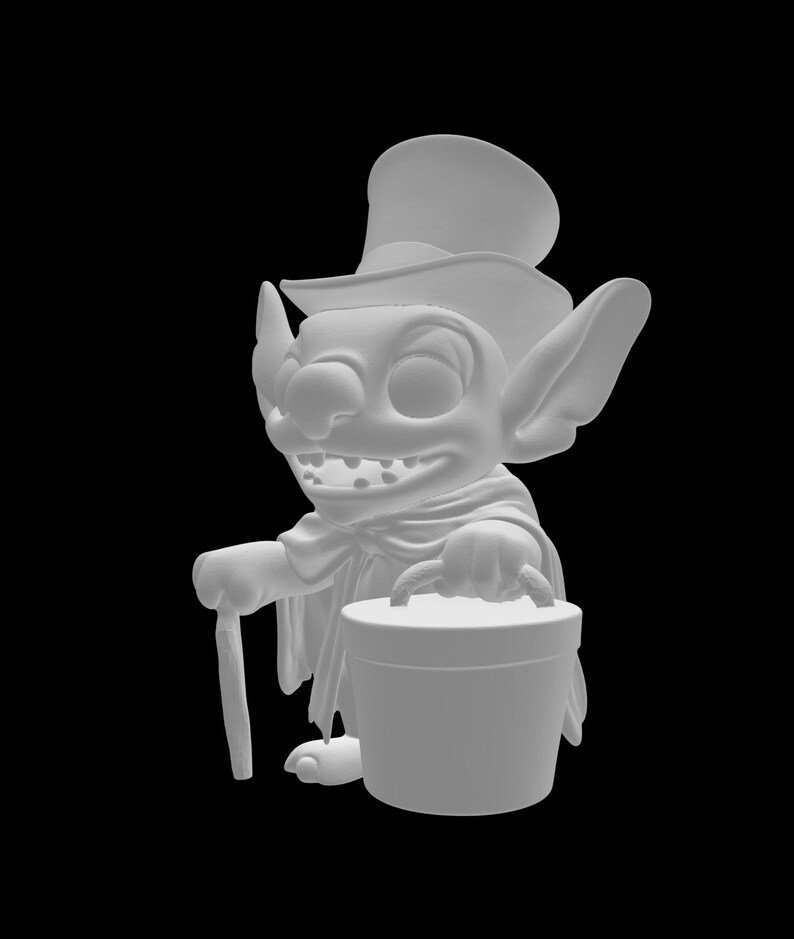 May include: A white figurine of a cartoon character with large ears, a top hat, and a cape. The character is holding a cane and a bucket with a handle. The figurine has a wide grin and is set against a black background.