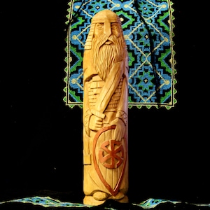 Hand-carved wooden statue Perun. PERUN Slavic god of thunder and lightning.