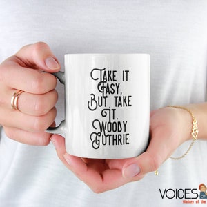 Woody Guthrie Relaxed & Determined Coffee Cup: &#39;Take it Easy, But Take It&#39;