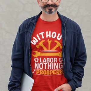 May include: A red t-shirt with a white graphic that says "Without labor nothing prospers". The graphic also includes a wrench and two hammers in yellow.