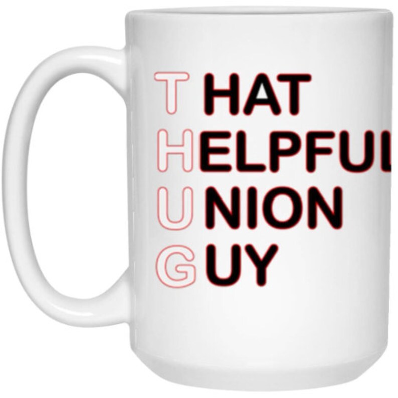 May include: White ceramic mug with black text that reads "THAT HELPFUL UNION GUY" in a vertical stack. The letters are outlined in red.