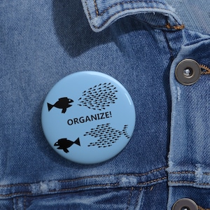 Join the Movement for Workers&#39; Rights with Our &quot;Organize!&quot; Fish Button Pin