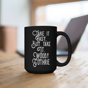 Woody Guthrie Relaxed & Determined Coffee Cup: &#39;Take it Easy, But Take It